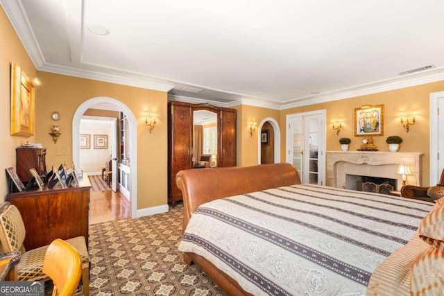 bedroom with crown molding and a closet