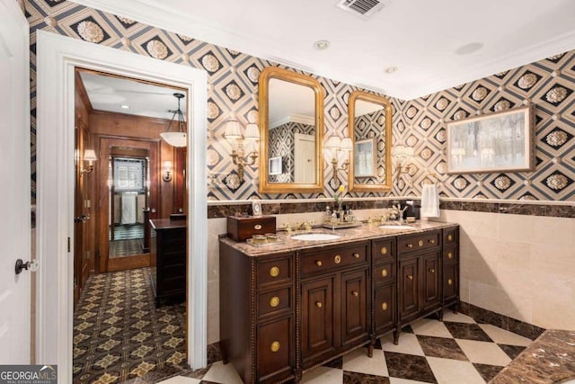 bathroom featuring vanity and crown molding