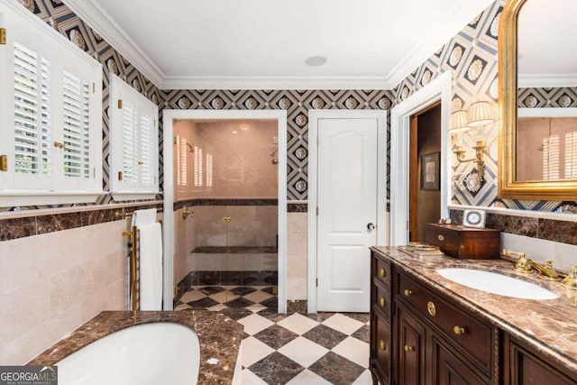 bathroom with vanity, crown molding, and shower with separate bathtub