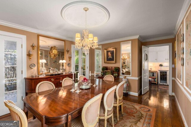 dining space featuring ornamental molding, a chandelier, beverage cooler, and dark hardwood / wood-style flooring