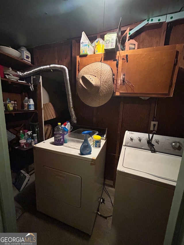 laundry area with independent washer and dryer