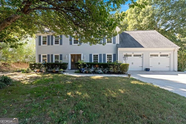 view of front of house featuring a garage and a front lawn