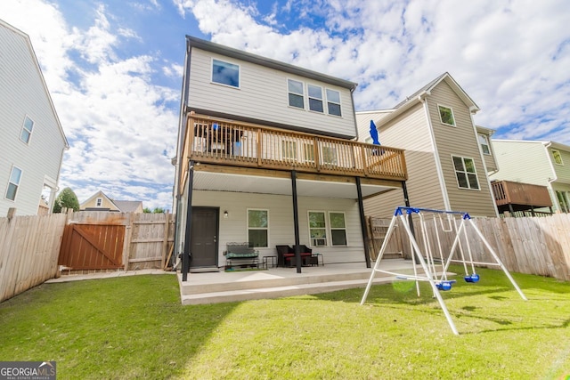 rear view of house featuring a yard and a patio