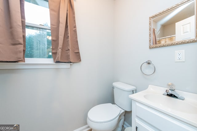 bathroom with vanity and toilet