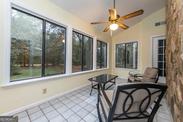 sunroom featuring a wealth of natural light, ceiling fan, and vaulted ceiling