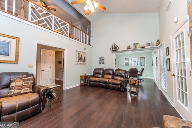 living room featuring high vaulted ceiling, ceiling fan, and dark wood-type flooring