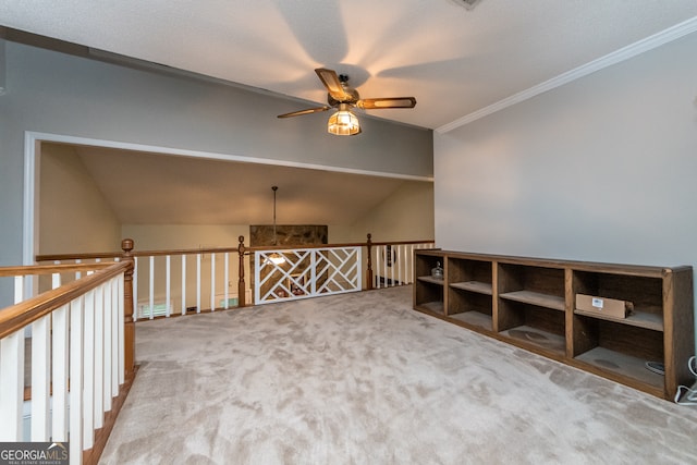 unfurnished room with light carpet, crown molding, ceiling fan, and lofted ceiling