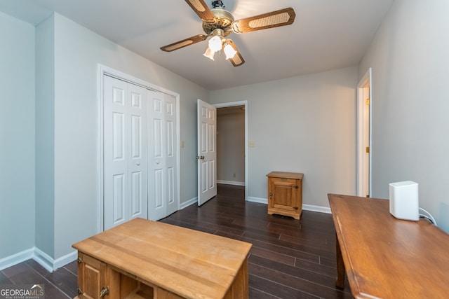 office space featuring dark hardwood / wood-style floors and ceiling fan