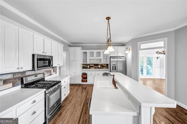 unfurnished dining area featuring hardwood / wood-style floors, a notable chandelier, a premium fireplace, and vaulted ceiling