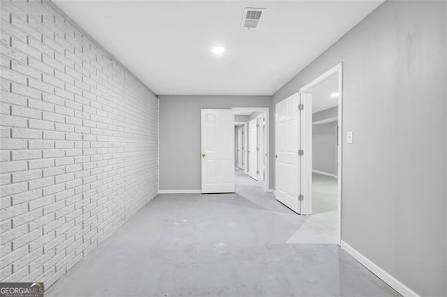 hallway with brick wall