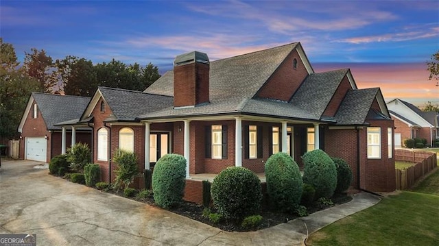 property exterior at dusk featuring a garage