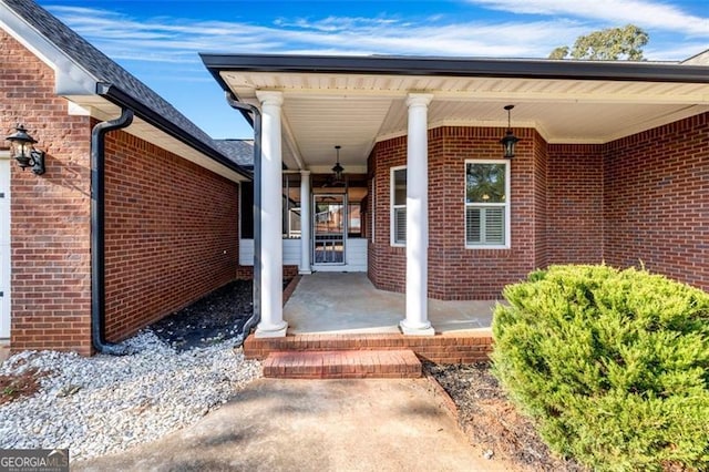 view of exterior entry with covered porch