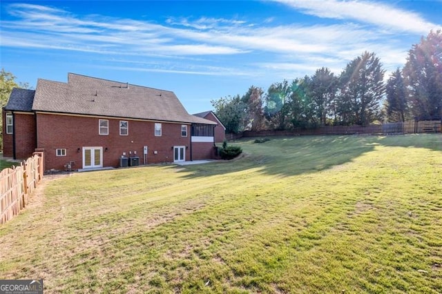 view of yard with french doors