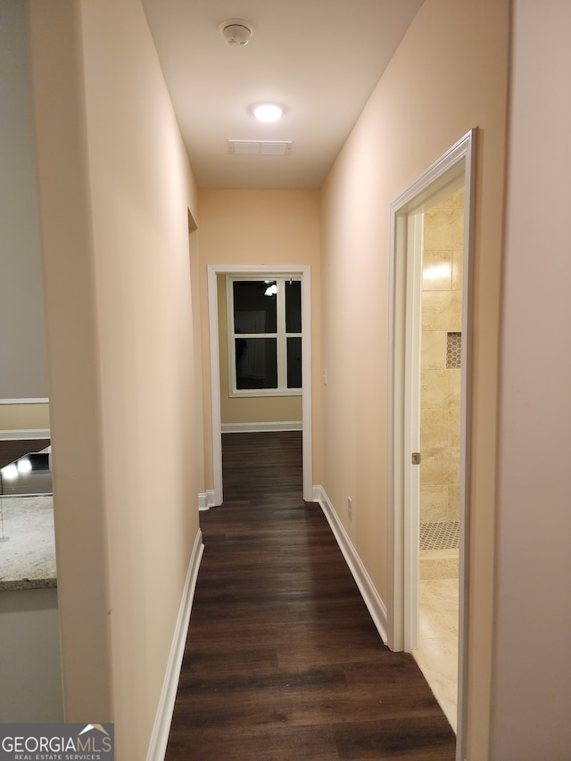 hall with dark hardwood / wood-style floors