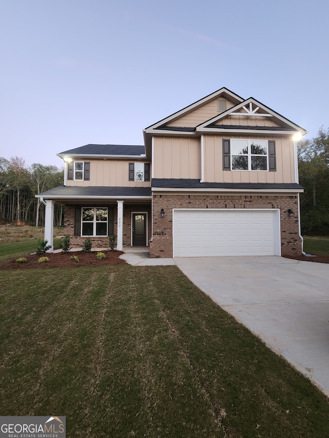 view of front of property with a front lawn and a garage