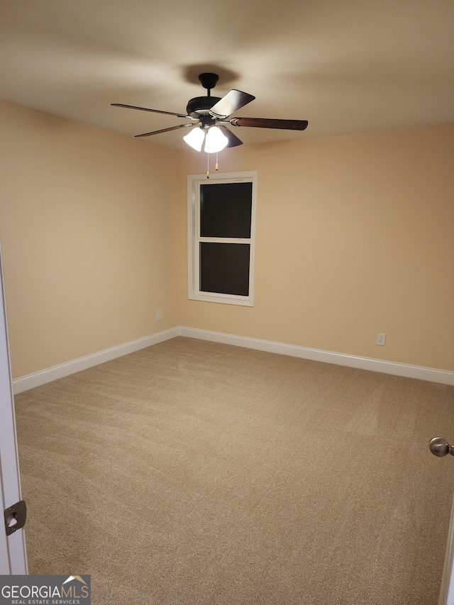 carpeted empty room with ceiling fan