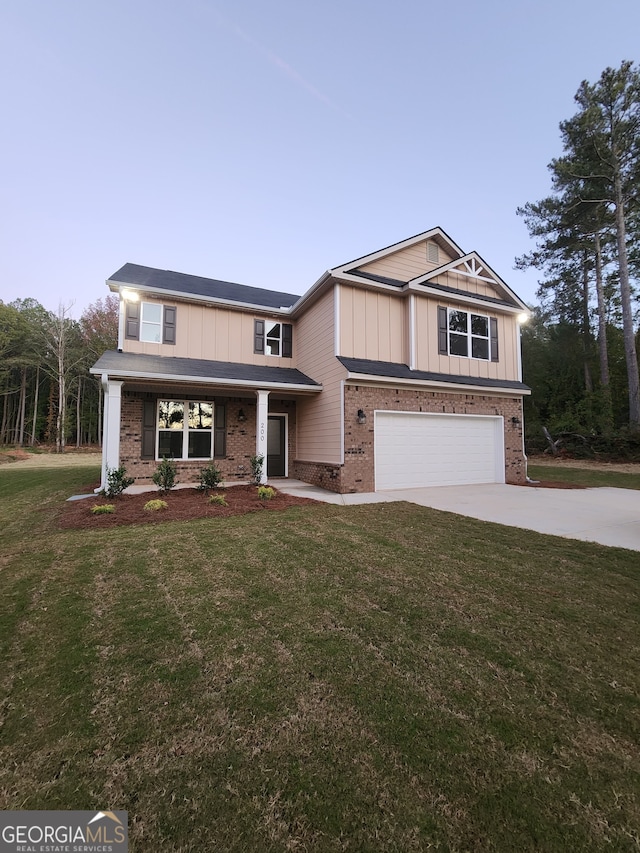 view of front facade with a front yard and a garage