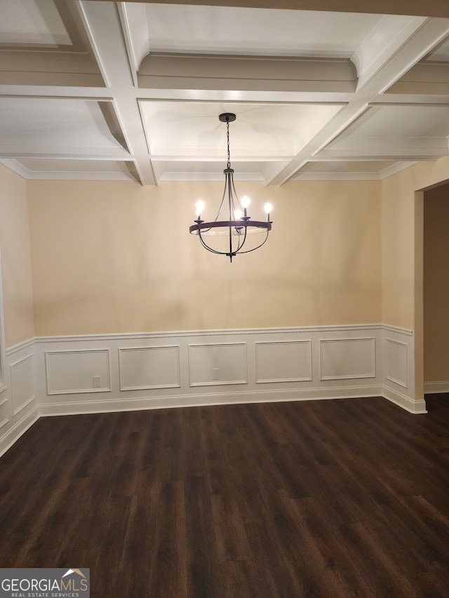 unfurnished dining area with dark hardwood / wood-style floors, beam ceiling, and coffered ceiling