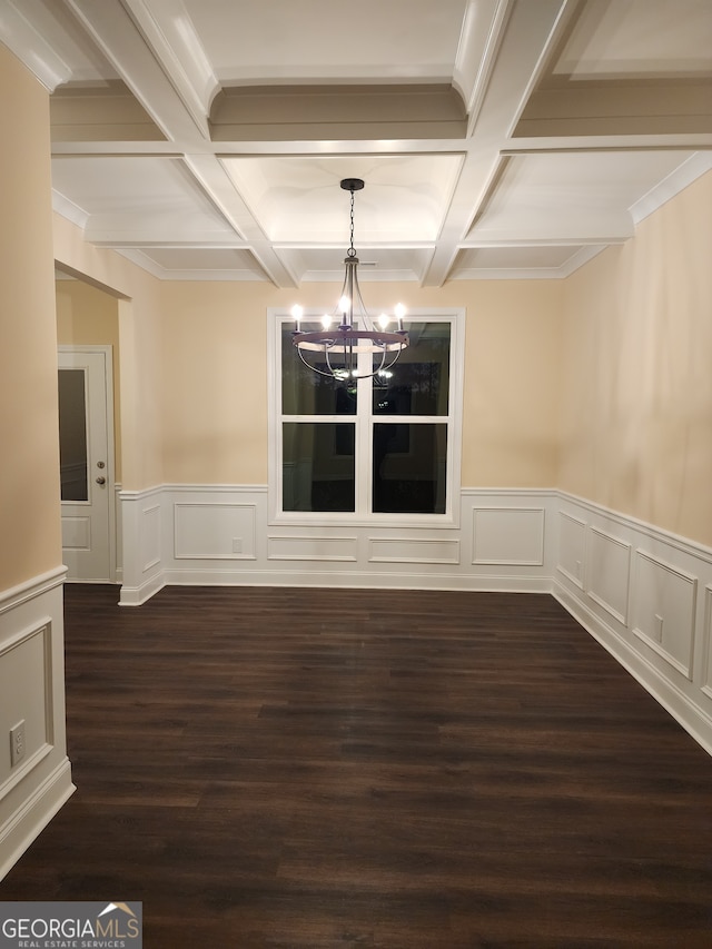 unfurnished dining area featuring dark hardwood / wood-style floors, beam ceiling, and coffered ceiling