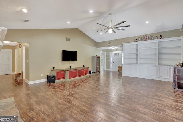 living room featuring ceiling fan, high vaulted ceiling, and light wood-type flooring