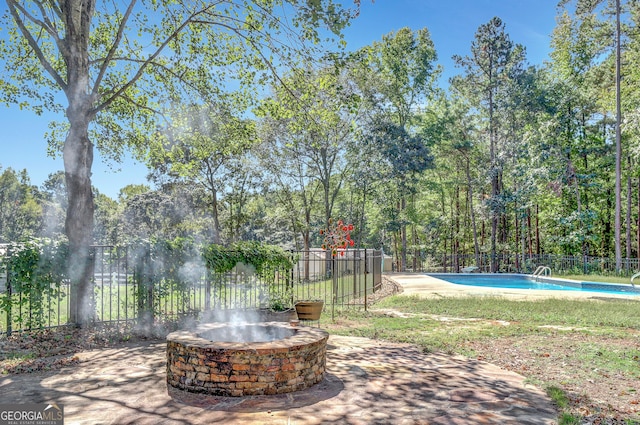 view of patio featuring a fenced in pool