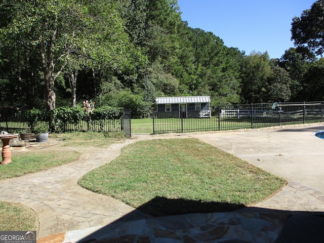 surrounding community with a patio area and a lawn