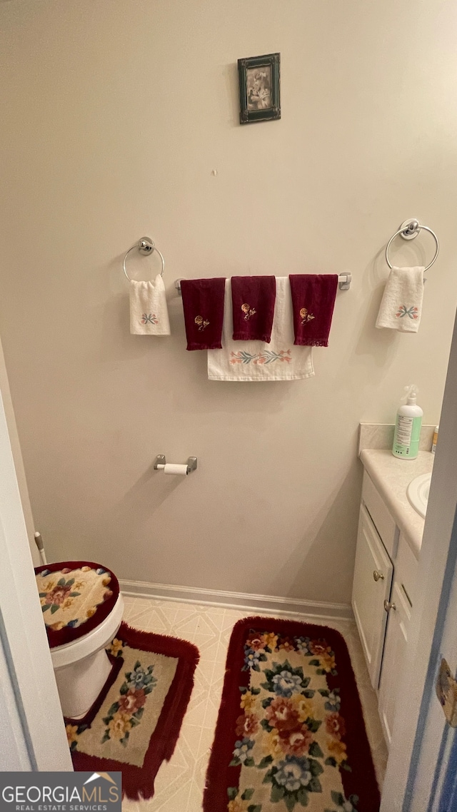 bathroom with vanity and toilet