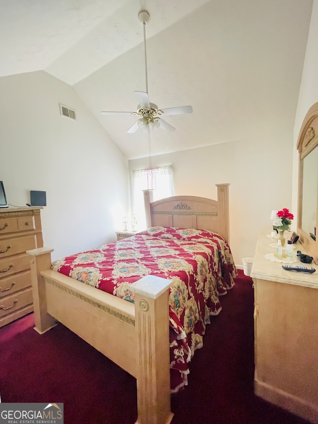 carpeted bedroom featuring ceiling fan and vaulted ceiling