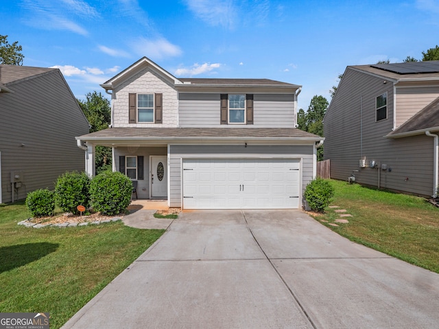 view of property featuring a front yard and a garage