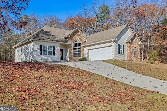 view of front facade with a garage and a front yard