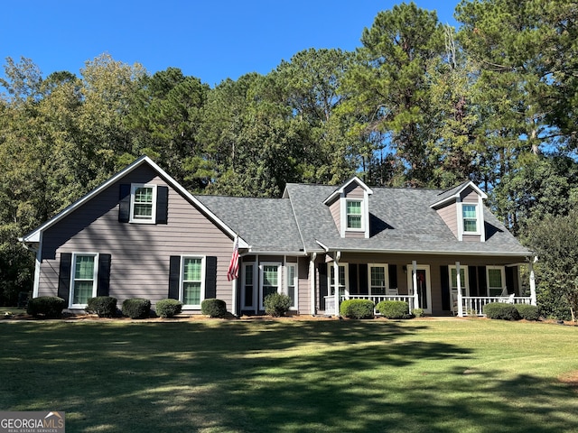 cape cod house featuring covered porch and a front lawn