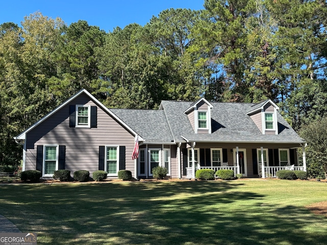 cape cod house featuring a front lawn and a porch