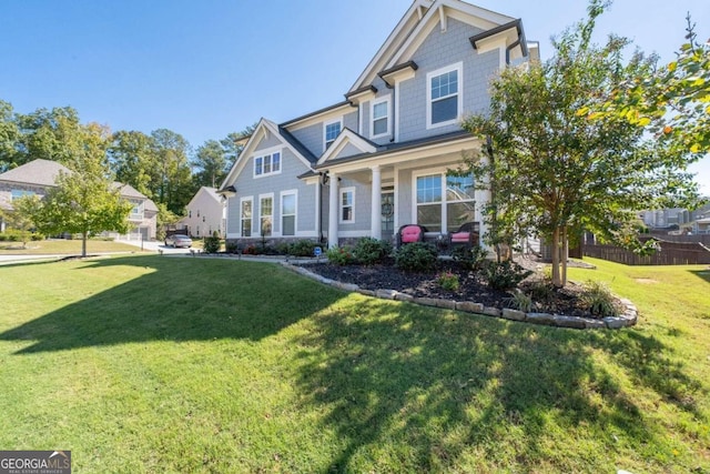 craftsman-style home with a front lawn