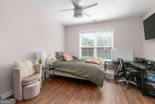 bedroom featuring ceiling fan and dark hardwood / wood-style floors