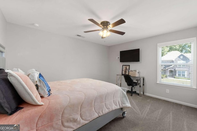 carpeted bedroom featuring ceiling fan