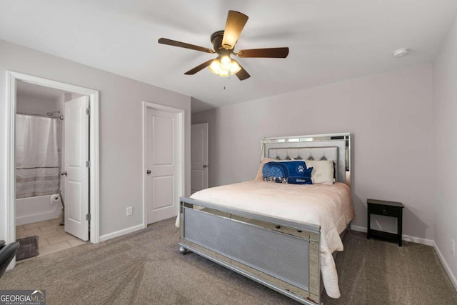 bedroom featuring ceiling fan, carpet floors, and ensuite bath