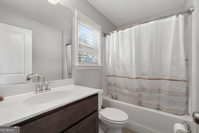 full bathroom with vanity, shower / bath combination with curtain, and toilet