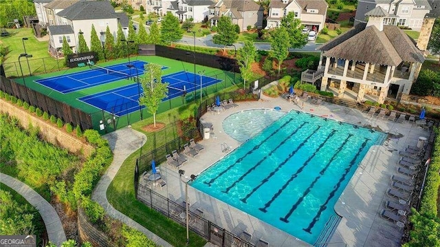 view of pool featuring a patio and tennis court