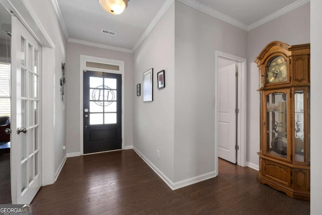 foyer with crown molding and dark hardwood / wood-style floors