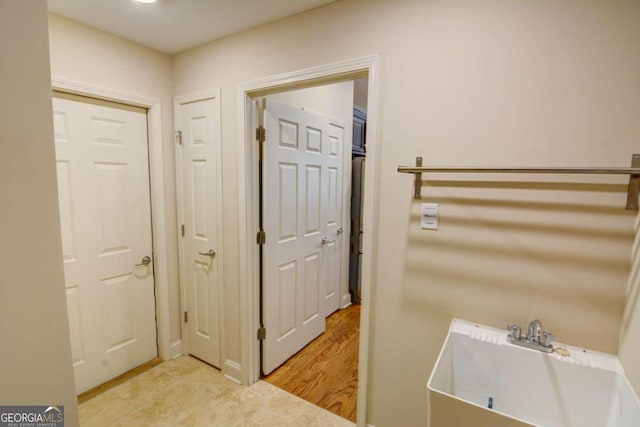 interior space with sink and light wood-type flooring