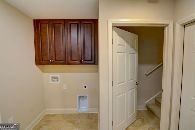 laundry area with hookup for an electric dryer, hookup for a washing machine, light tile patterned floors, and cabinets