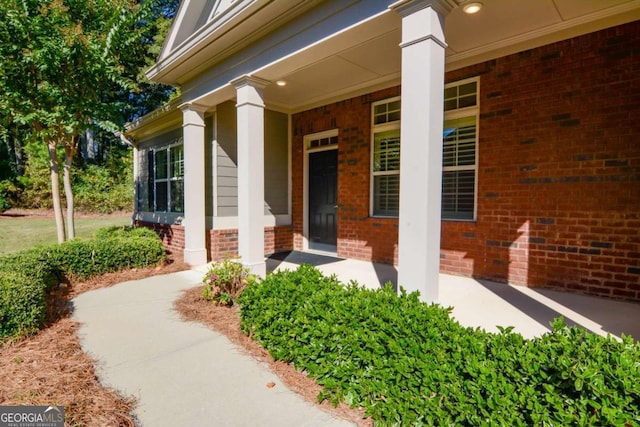 doorway to property featuring covered porch