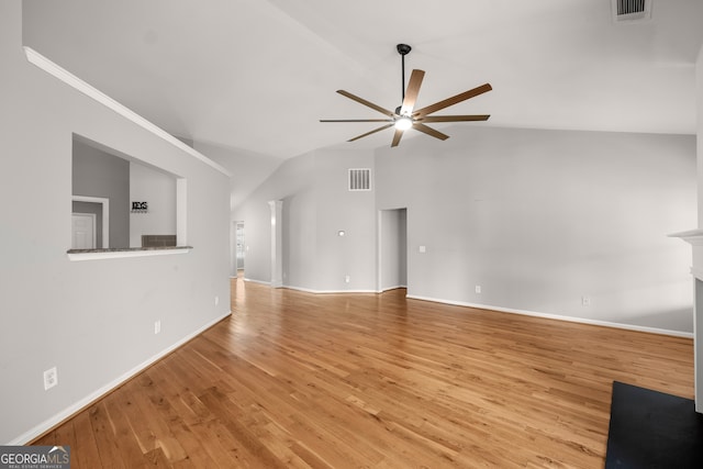 unfurnished living room with vaulted ceiling, light hardwood / wood-style flooring, decorative columns, and ceiling fan