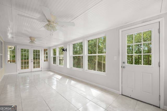 unfurnished sunroom featuring french doors and ceiling fan