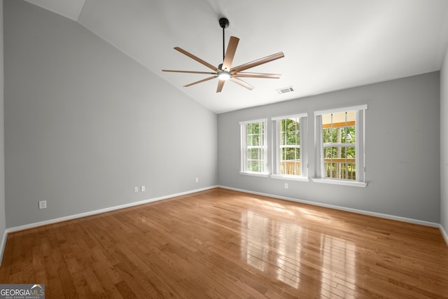 unfurnished room featuring ceiling fan, lofted ceiling, and hardwood / wood-style floors