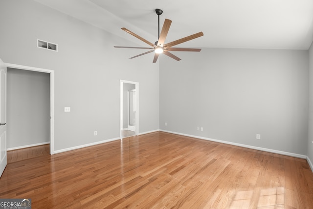 unfurnished room featuring light hardwood / wood-style floors, high vaulted ceiling, and ceiling fan