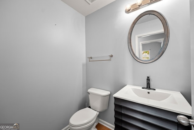 bathroom with vanity and toilet