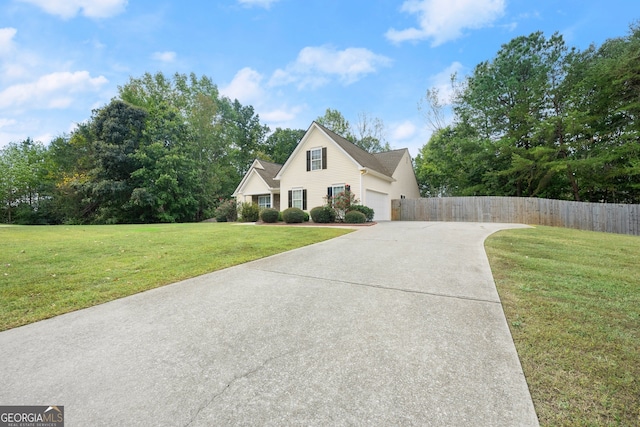 view of front facade with a front lawn and a garage