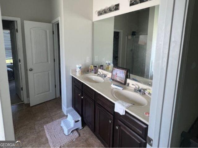 bathroom with vanity and walk in shower