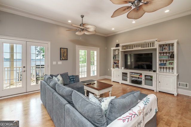 living room with french doors, a healthy amount of sunlight, and ceiling fan